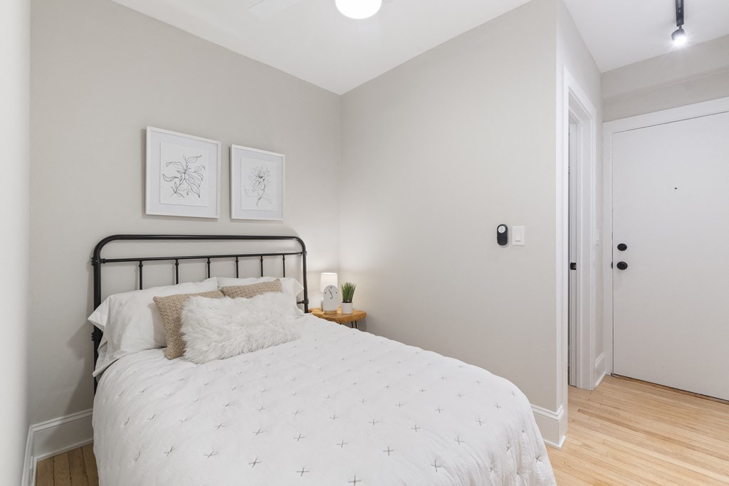 a bedroom with a bed and a closet