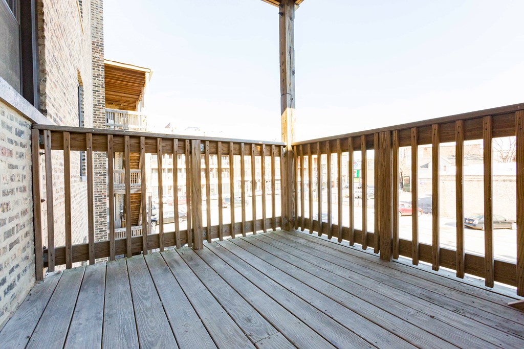 the deck of a house with a view of the ocean