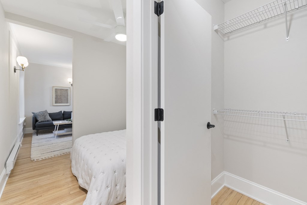 a bedroom with a bed and a closet