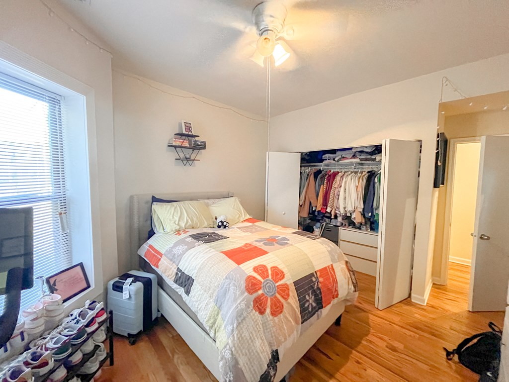 a bedroom with a bed and a closet