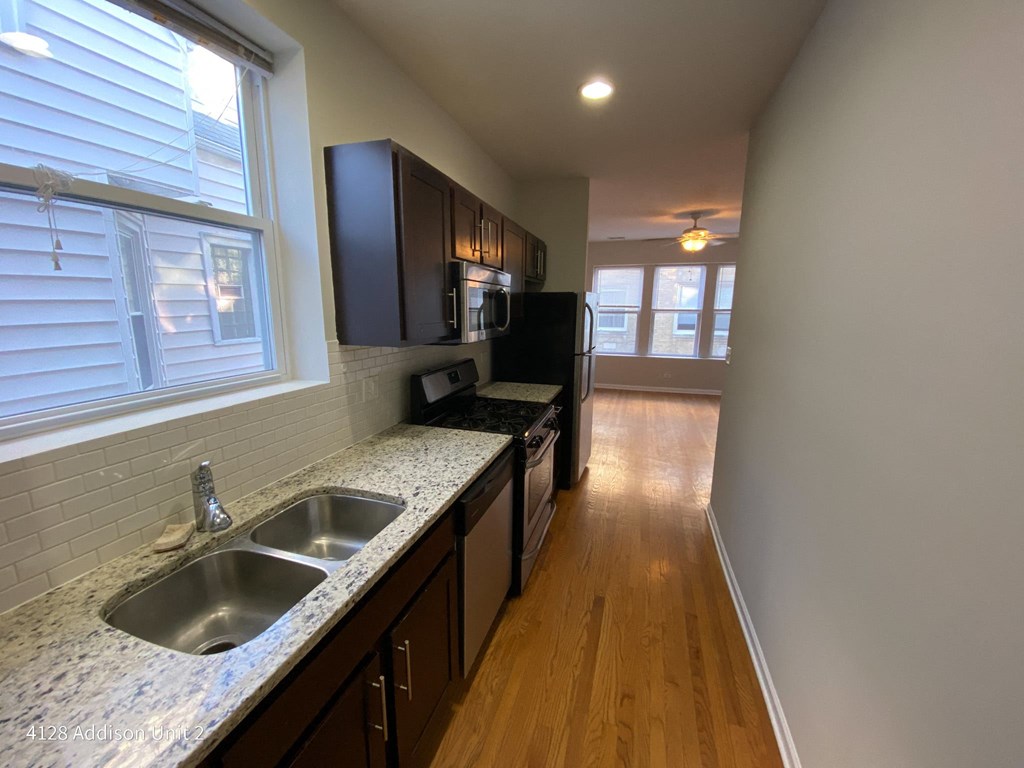 a kitchen with granite counter tops and a sink