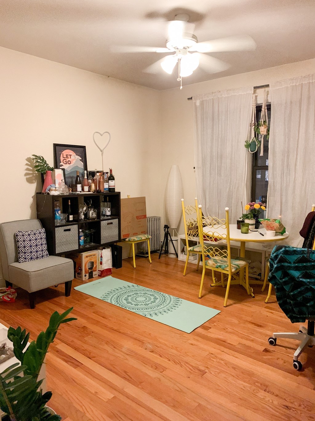 a living room and dining room with a wood floor