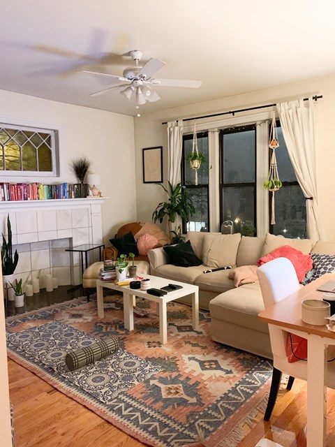 a living room with a couch and a table