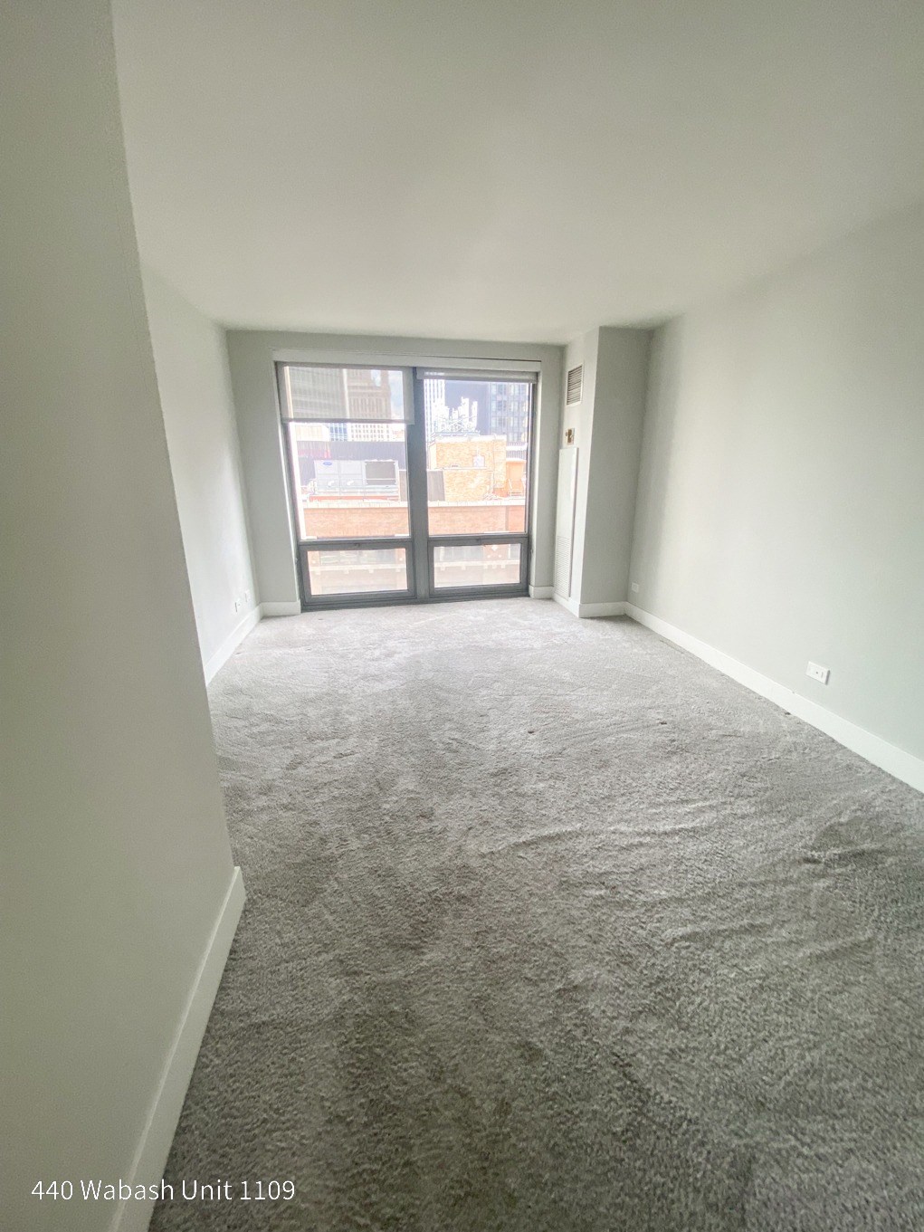 an empty room with a large window