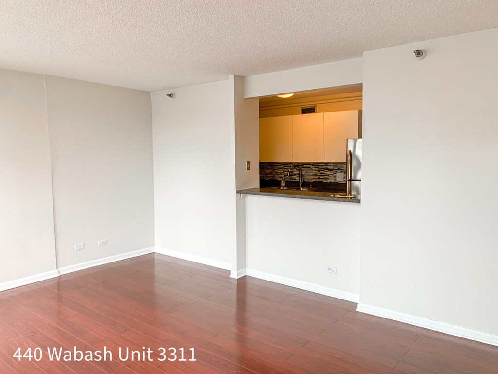 the living room and kitchen of a 445 unit