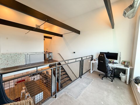 A room with a desk and a computer.