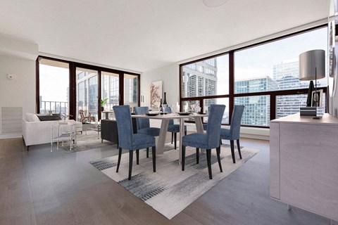 a rendering of a living room with a dining table and a view of the city