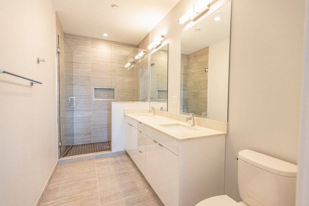 a bathroom with a sink toilet and a shower