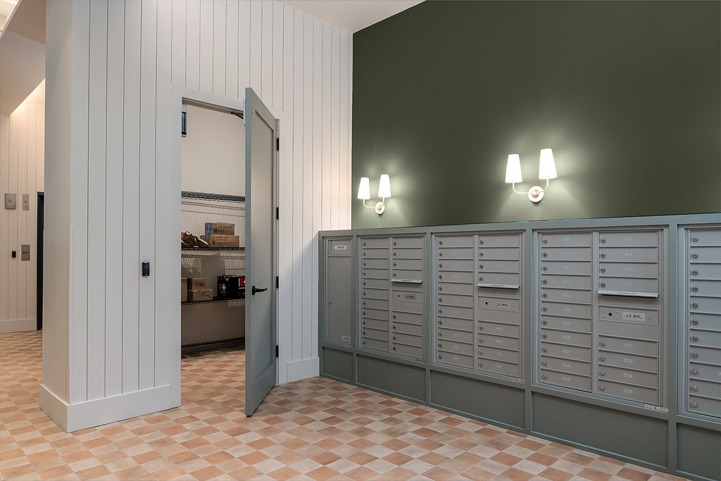 the laundry room has plenty of cabinets and a door to the closet