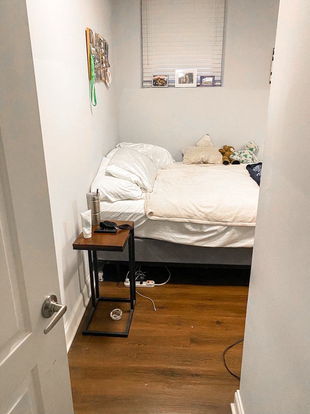 a room with a bed and a table in it