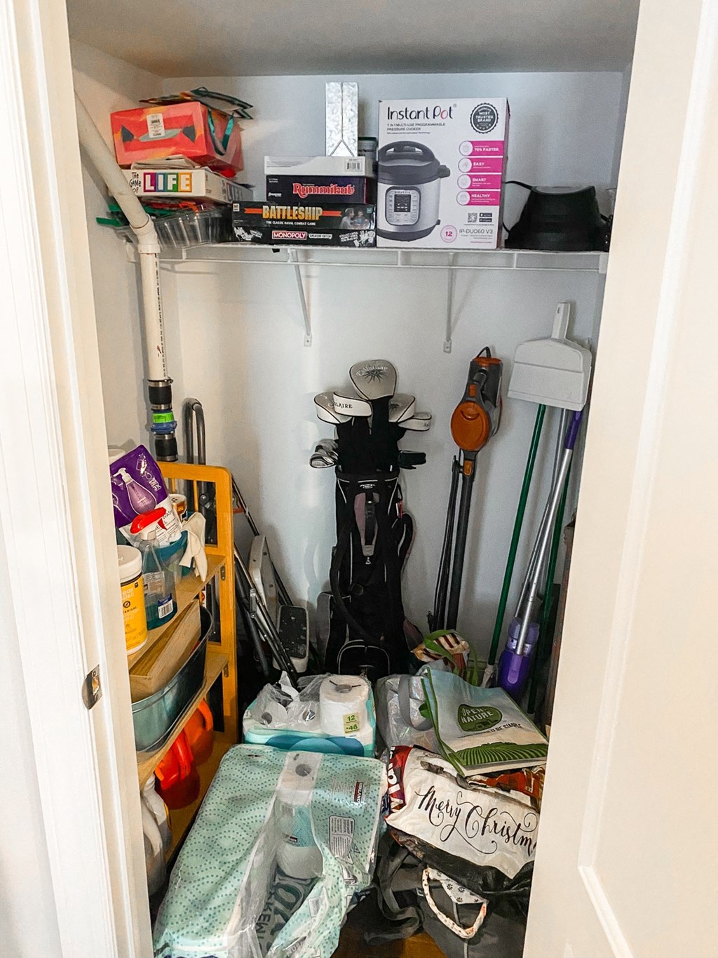 the inside of a closet with a bunch of items in it