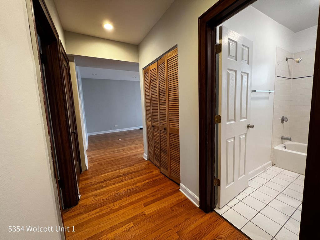 a bedroom with a closet and a bathroom