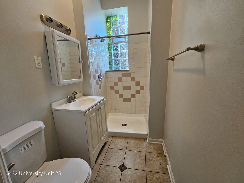 a small bathroom with a toilet sink and shower