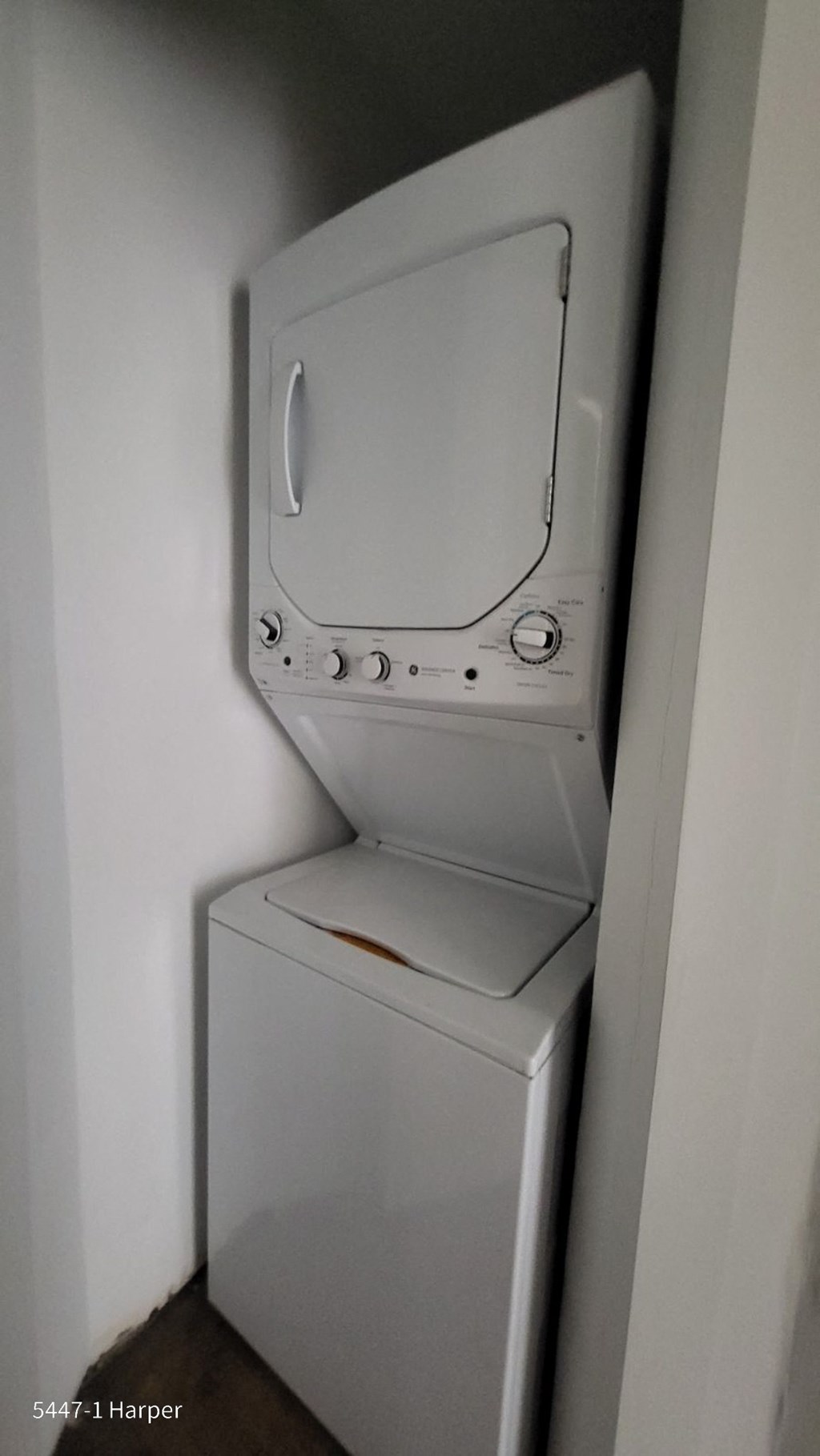 a washer and dryer in a closet in a bathroom