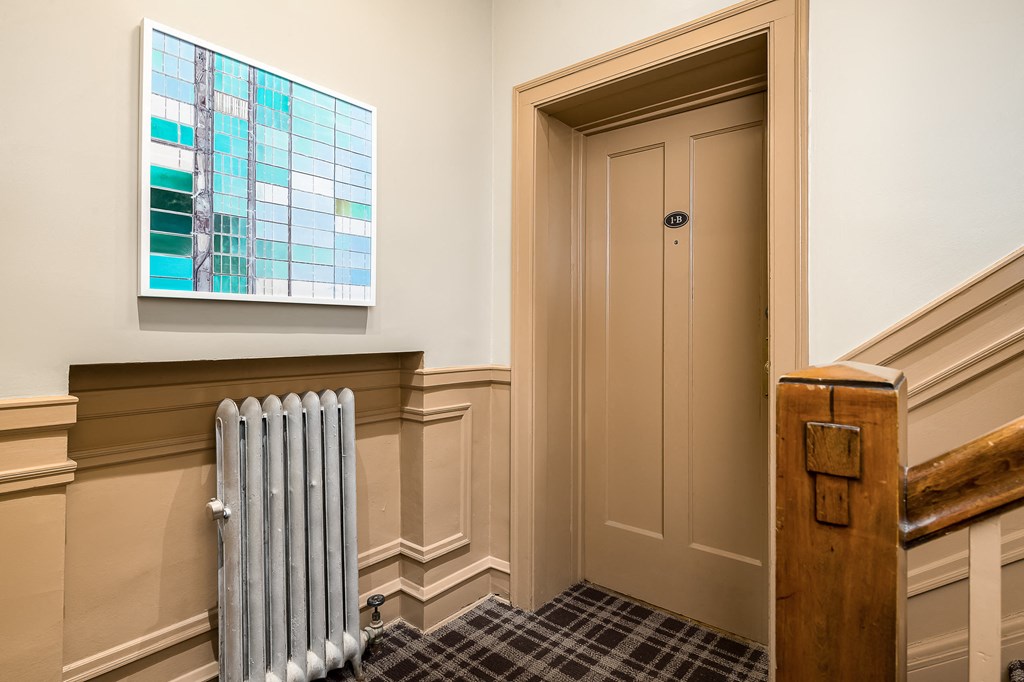 a room with a radiator and a door