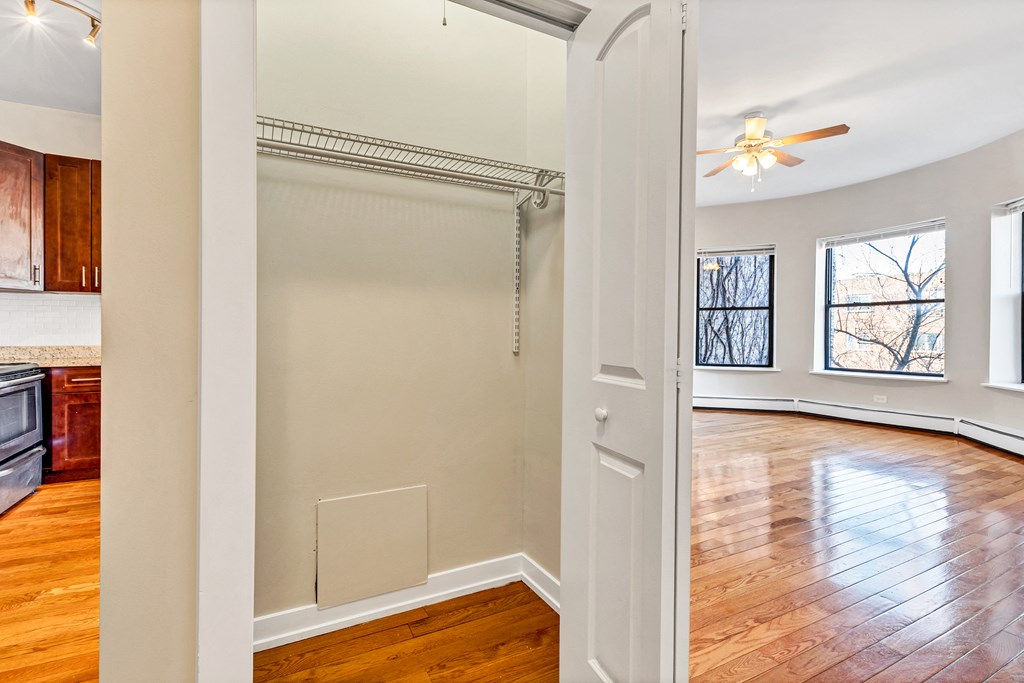 an empty living room with a sliding closet door