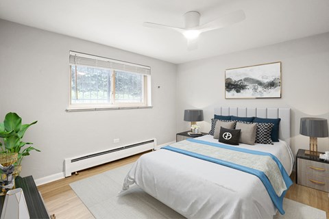 a bedroom with a bed and a window