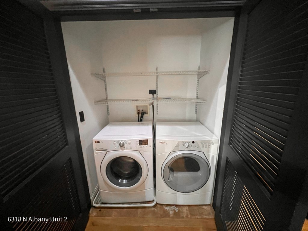 a small laundry room with a washing machine and a dryer