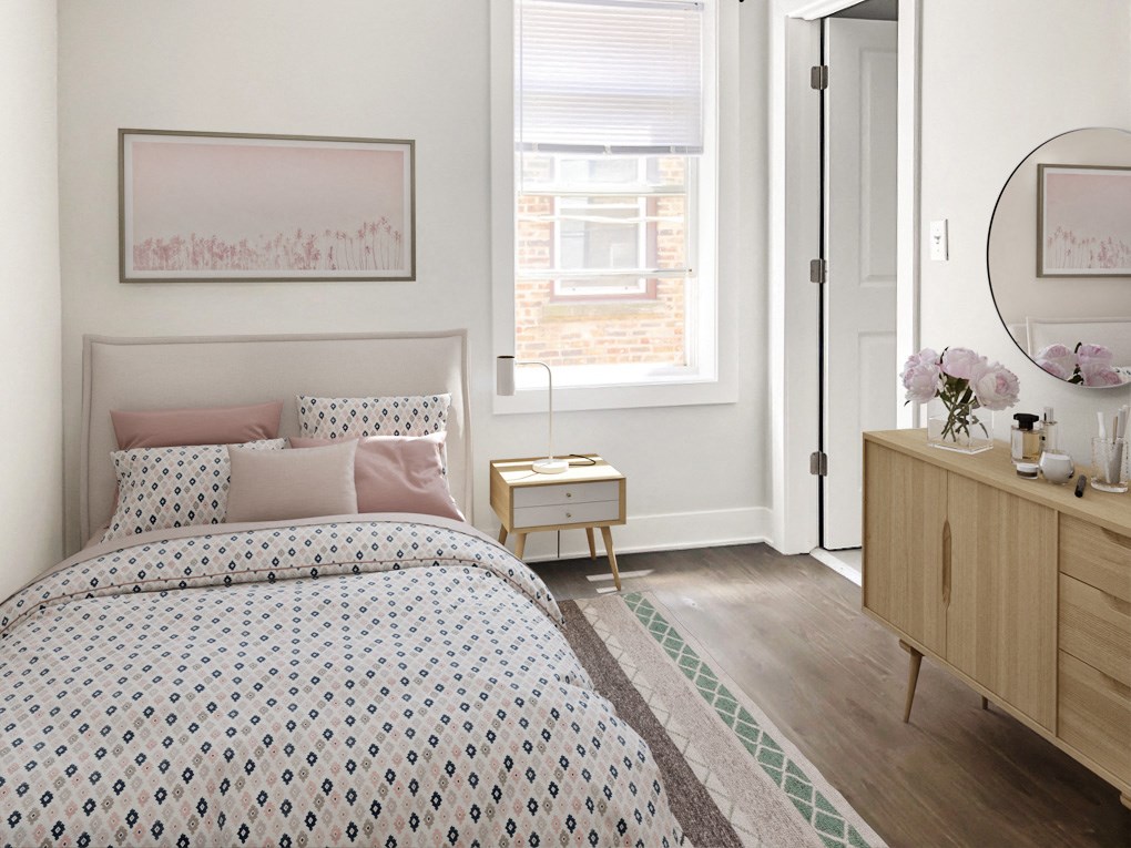 a bedroom with a bed and a dresser and a window