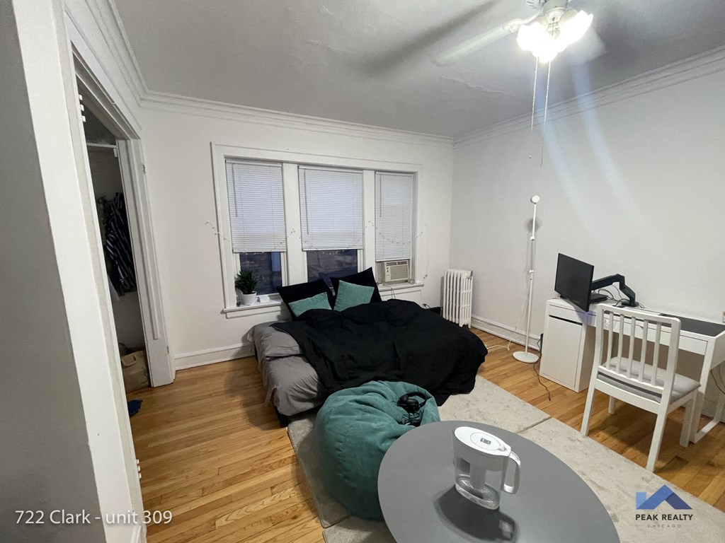 a living room with a couch and a table and a tv