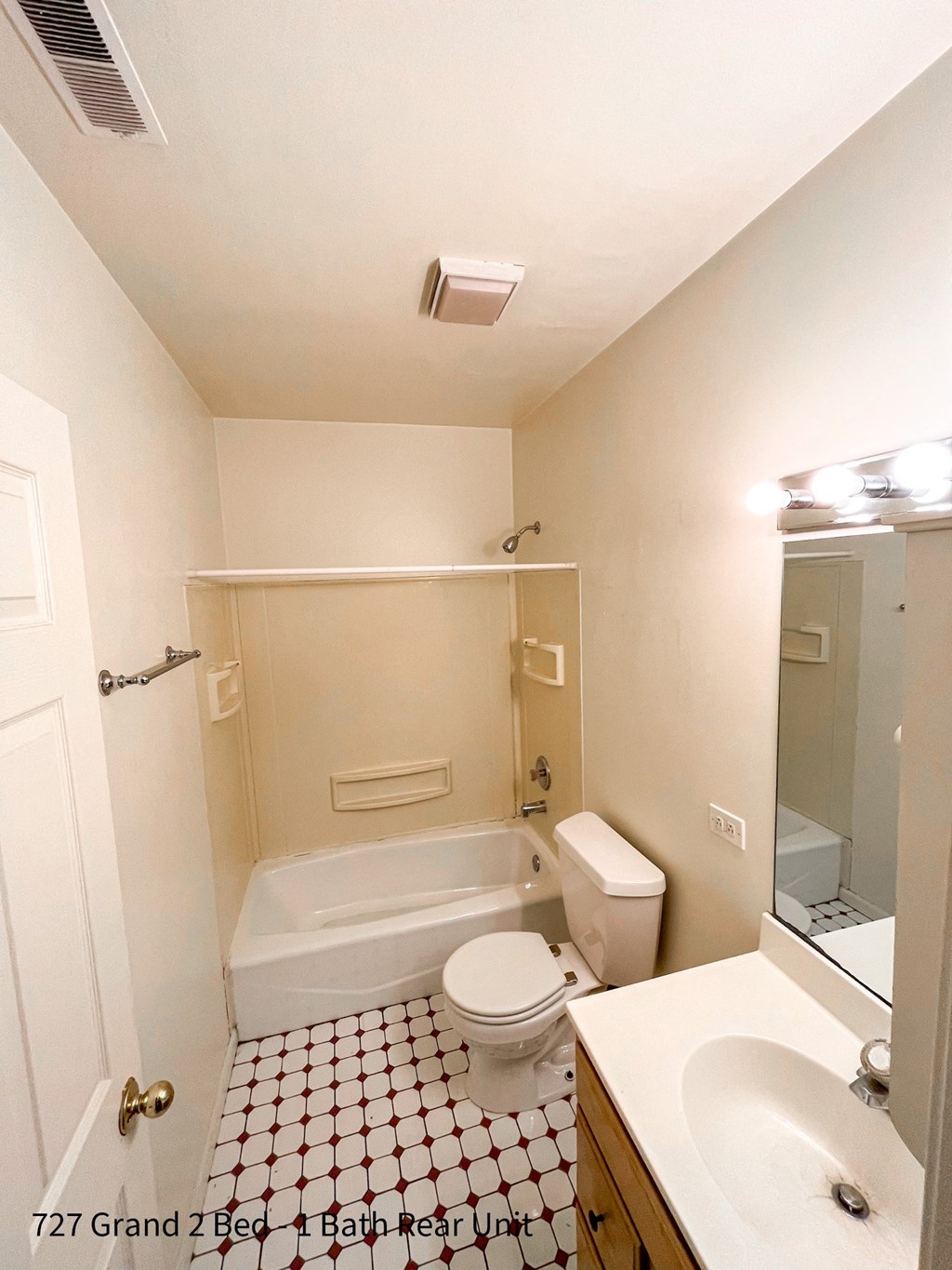 a bathroom with a toilet sink and bathtub