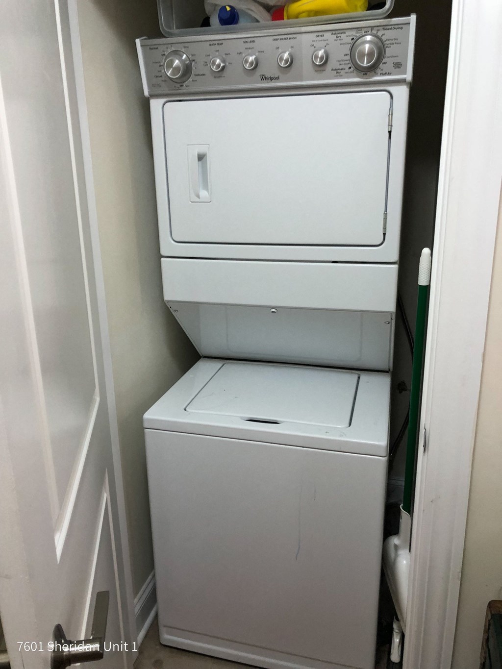 a white washer and dryer in a small room