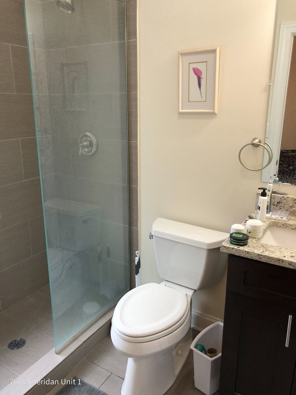 a small bathroom with a toilet and a shower