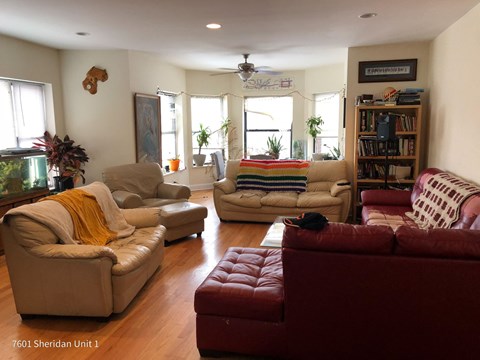 a living room filled with furniture and a fish tank