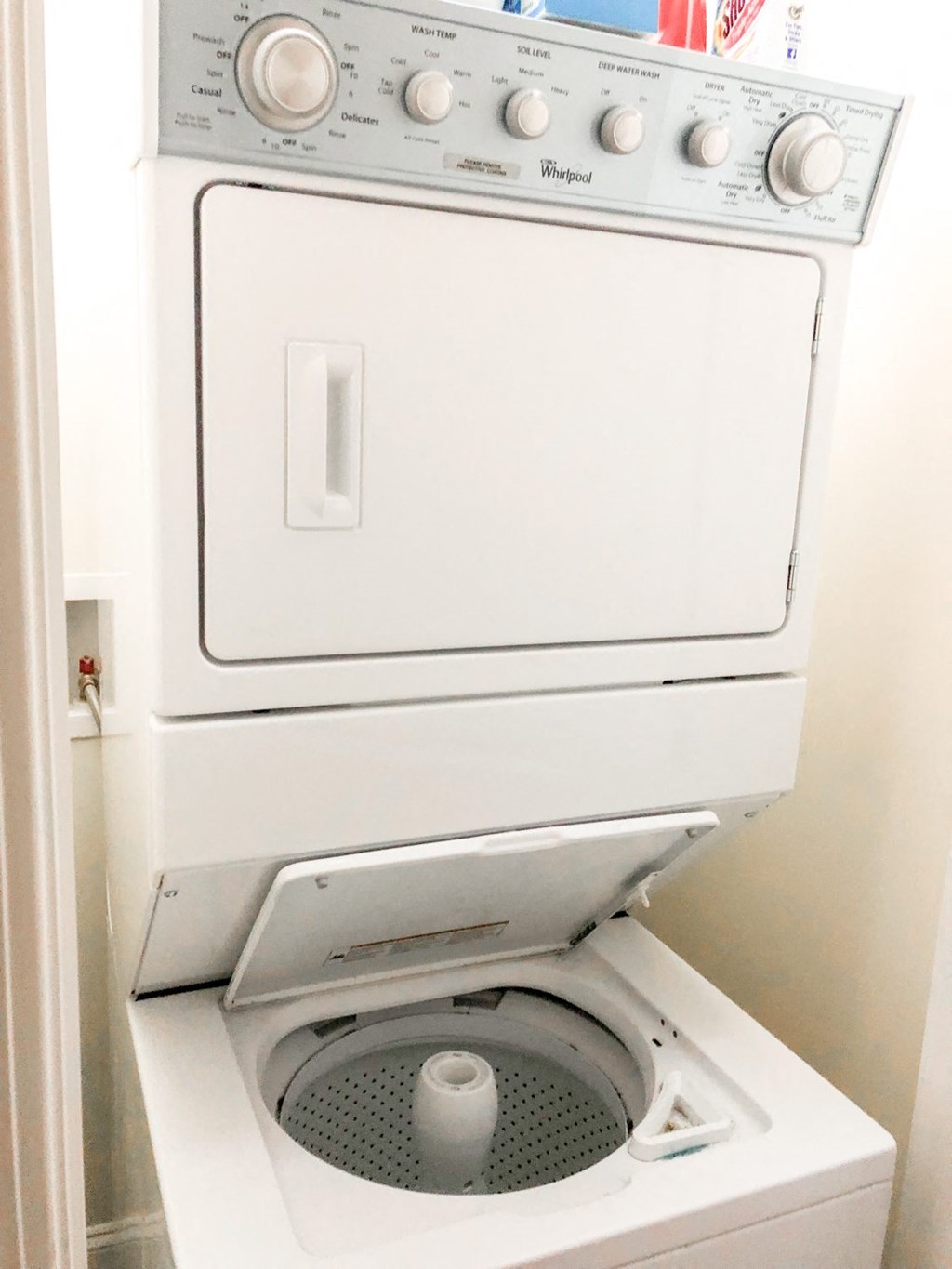 a white washer and dryer in a white room