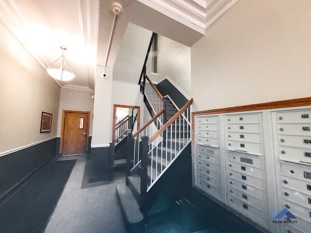 a staircase in a building with a bunch of mailboxes