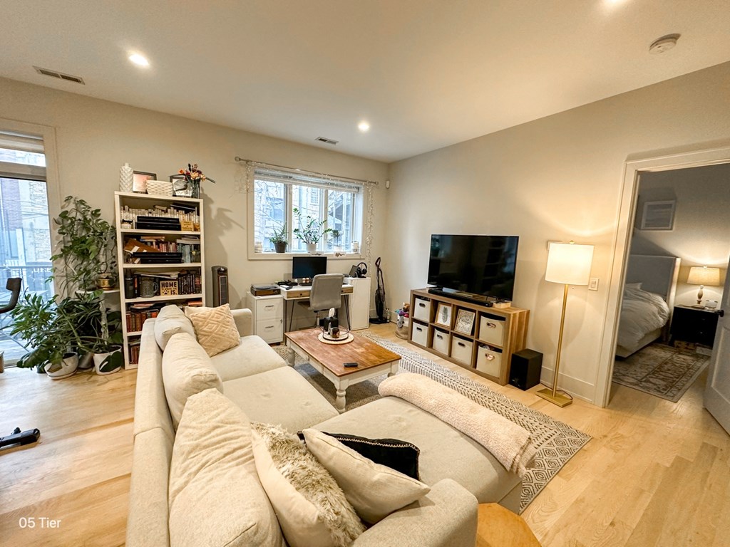 a living room with a couch and a tv