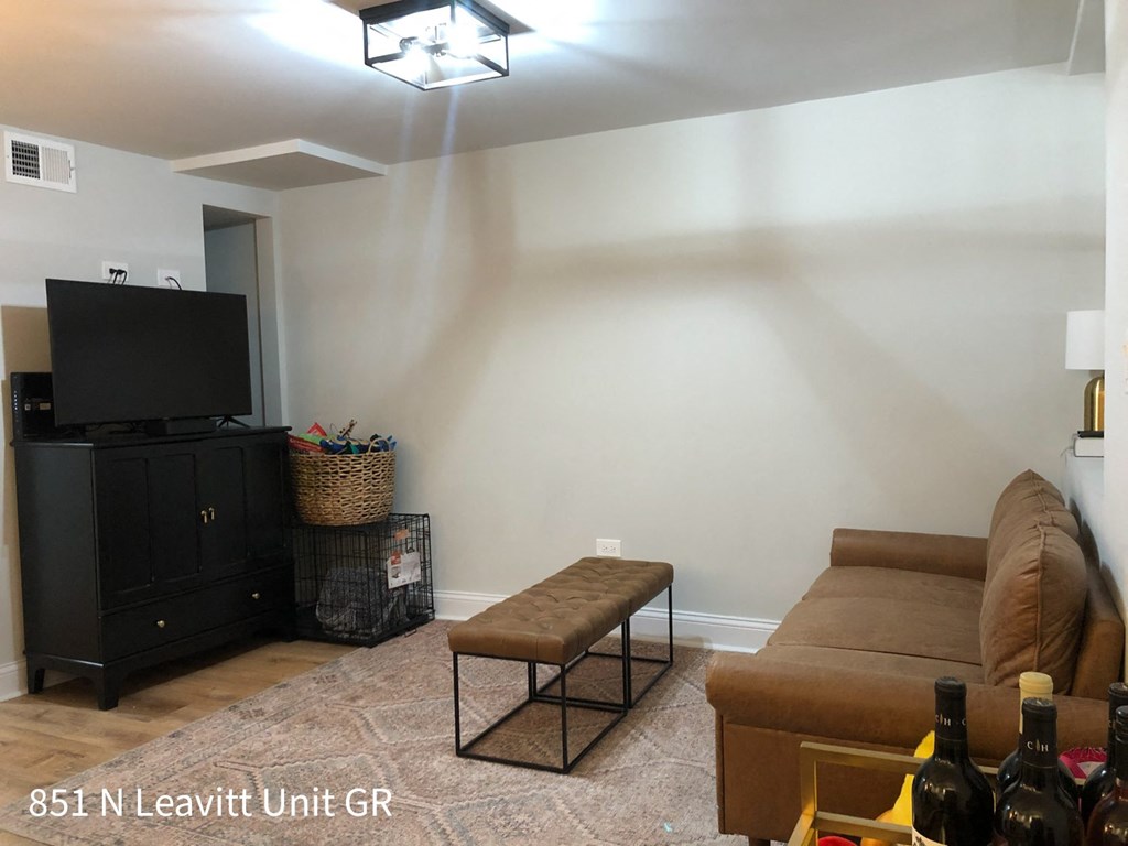 a living room with a couch and a tv