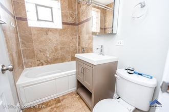 a bathroom with a toilet sink and bathtub