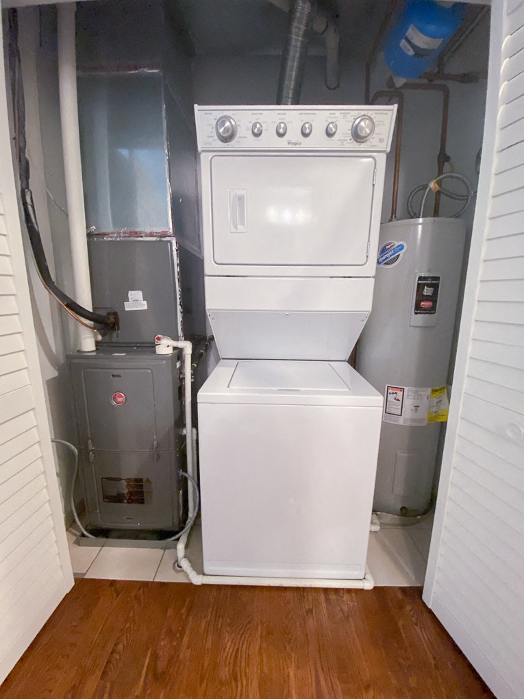 a washer and dryer in the corner of a room