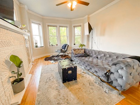 a living room with a large couch and a rug