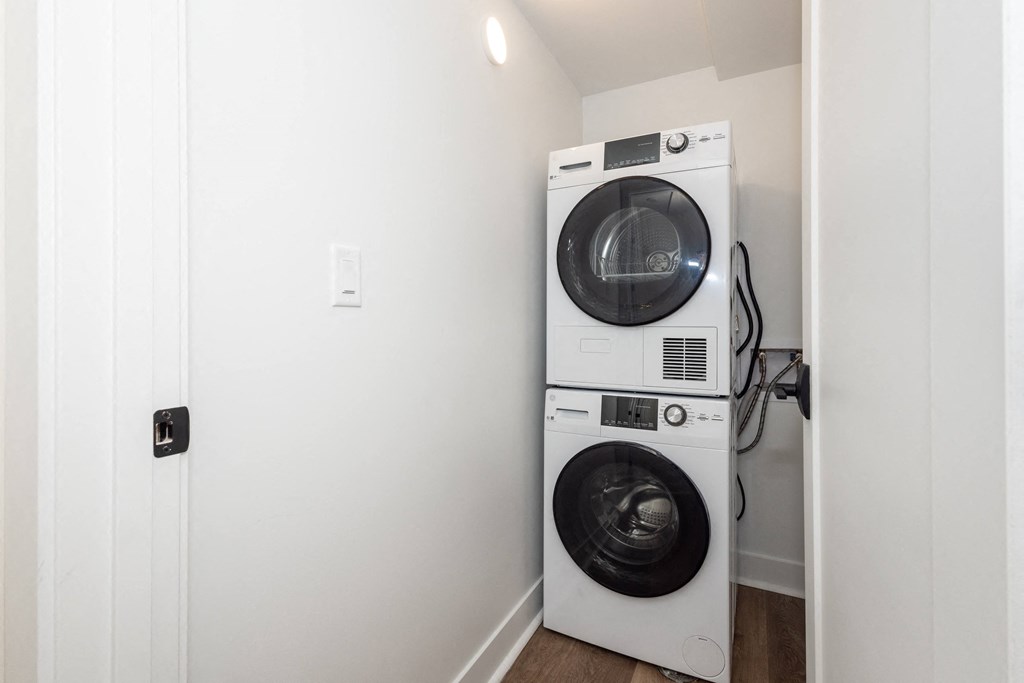 a small laundry room with a washing machine and a dryer