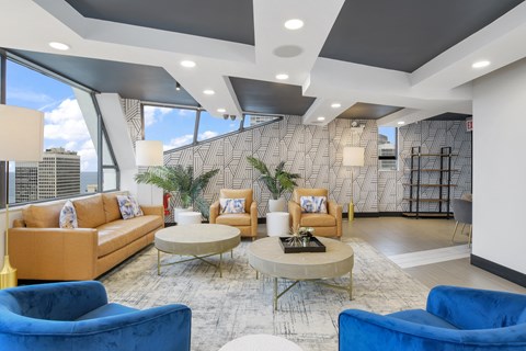 a living room with couches and chairs and a table