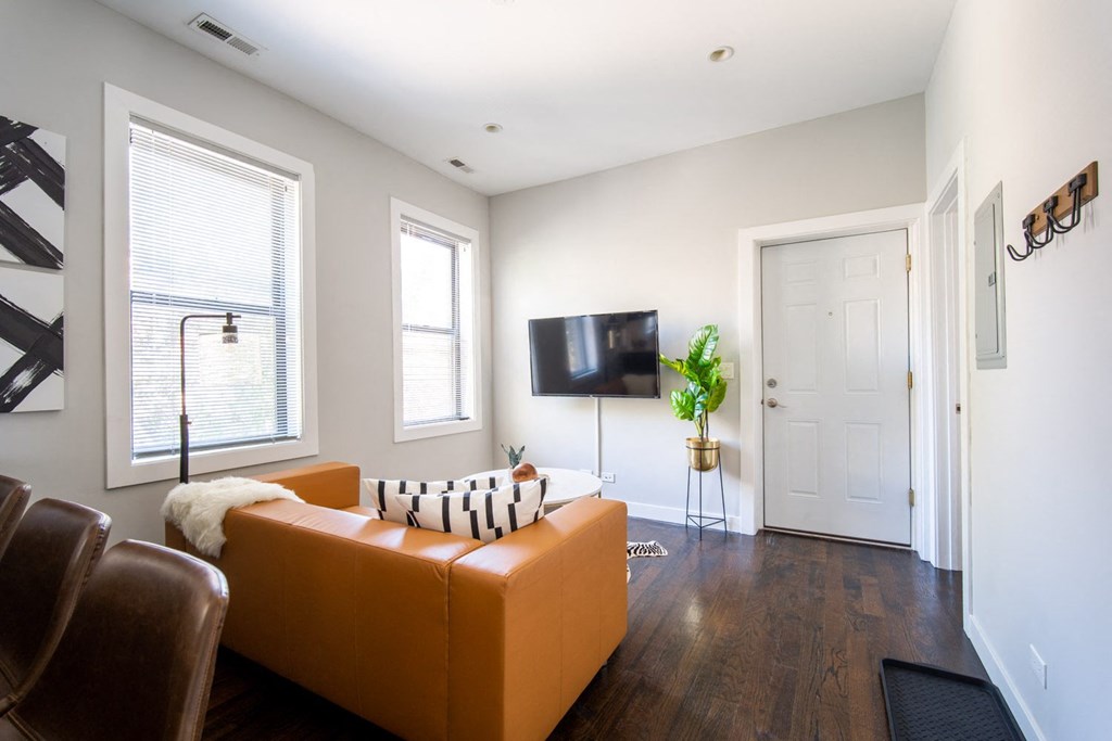 a living room with a couch and a tv