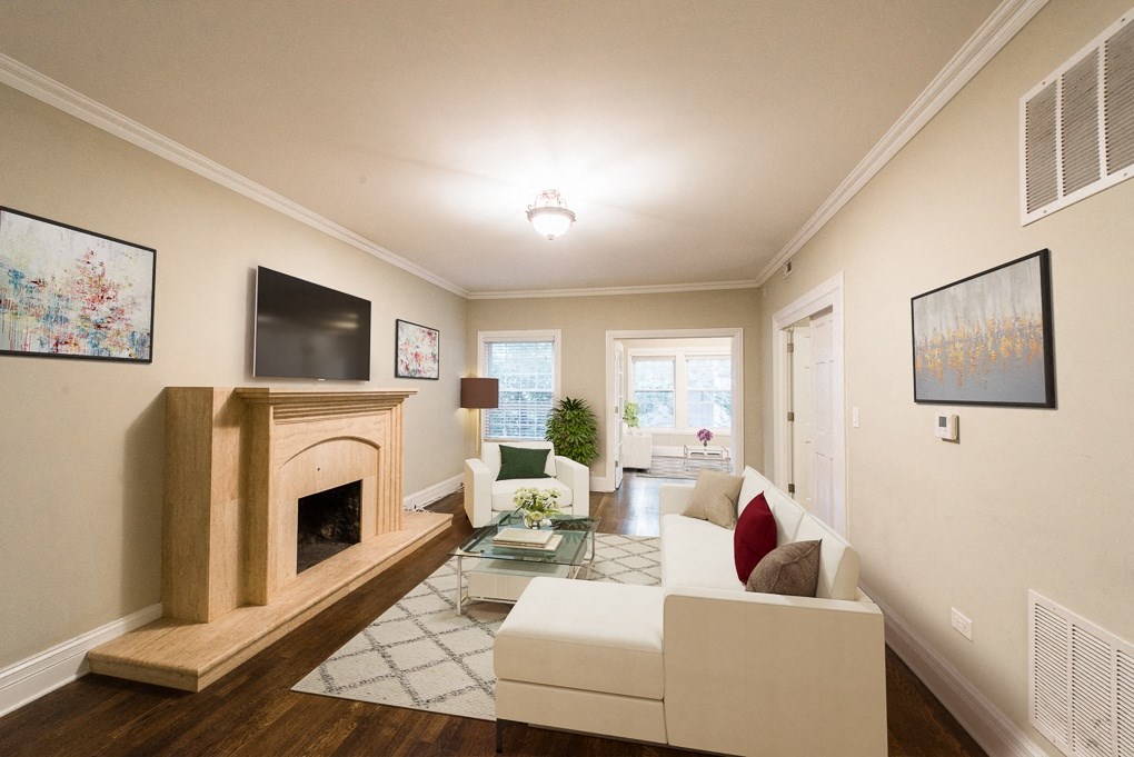 a living room with a couch and a fireplace