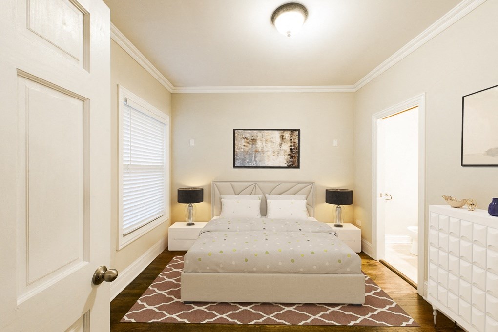 a bedroom with a bed and two night stands