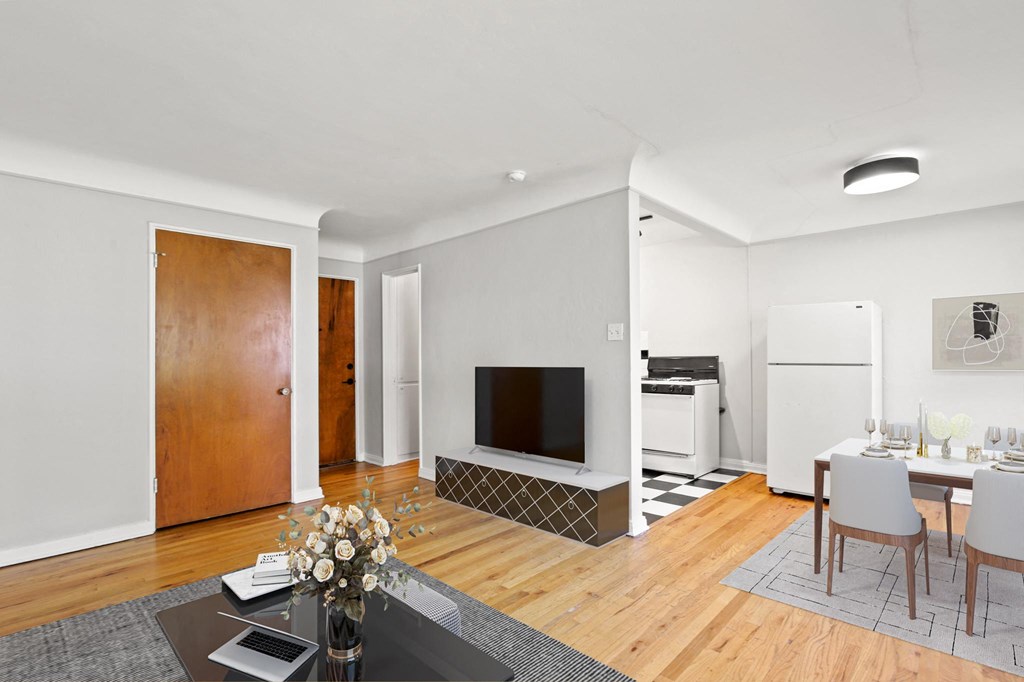 a living room with a table and a television
