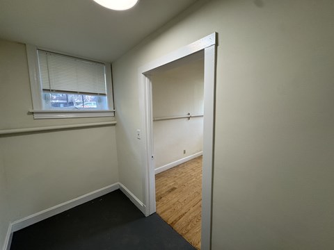 A room with a doorway leading to another room.