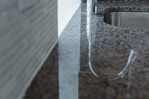 A close up of a sink with a faucet.