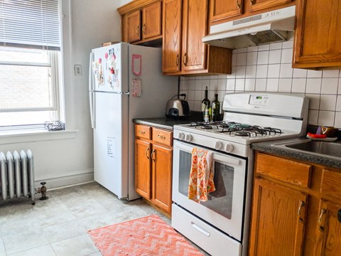 a kitchen with a stove and a refrigerator