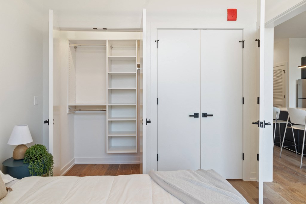 a room with a wall with pink and blue triangles on it