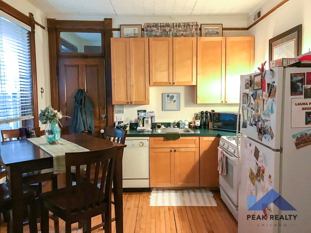 a view of the kitchen from the dining room