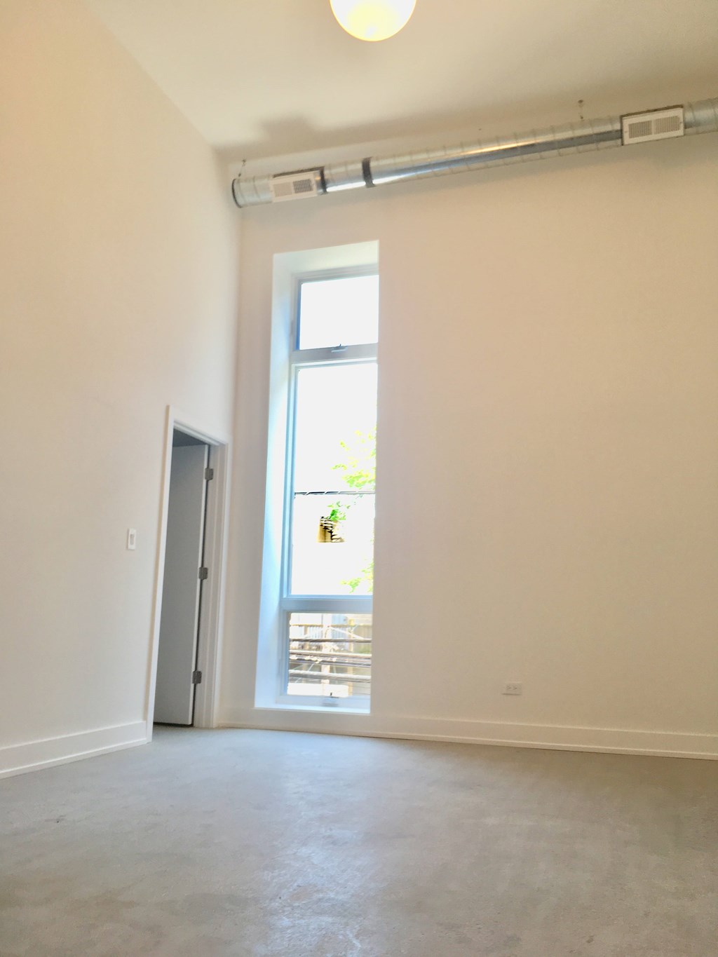 A room with a door and a window.