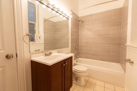 A bathroom with a white toilet and a white sink.