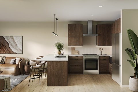 A modern kitchen with wooden cabinets and a large island.