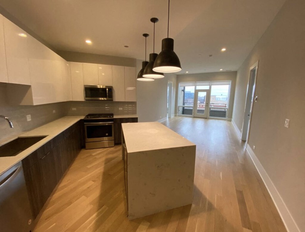 a kitchen with a large island in the middle